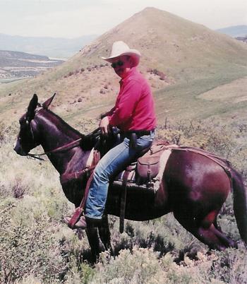 Bill Jons riding his mule.
