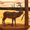 Elk Wood Carving near tree by Bill Jons