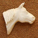 View a larger carved antler tie tack by Bill Jons